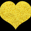 A heart shape made of yellow soft polymer clay candy sprinkles for cake decorating