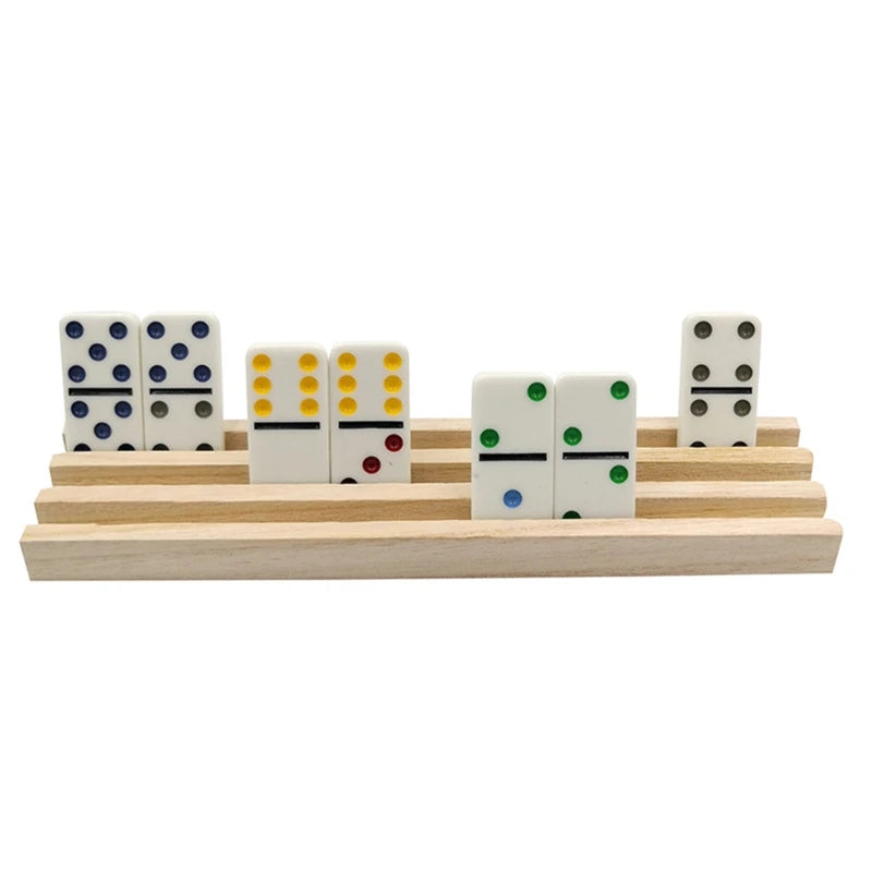 A wooden domino rack set of four tiles in various colors and patterns arranged on a light wooden base.