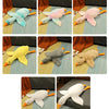 A collection of oversized kawaii goose plush pillows in various colors including blue, pink, yellow, gray, and white.