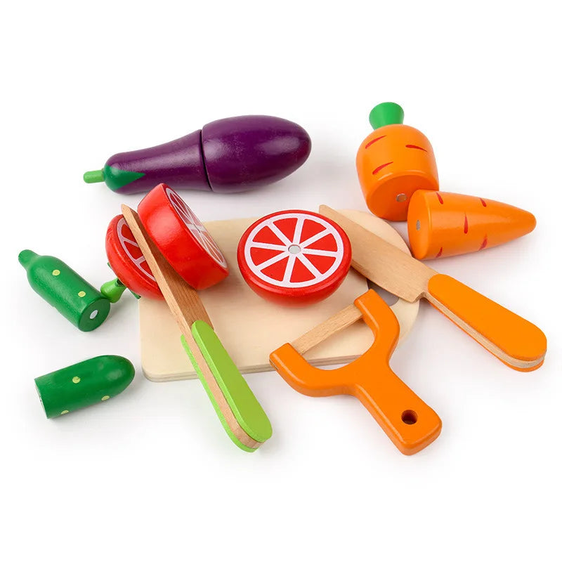 A wooden magnetic fruit and vegetable cutting play set featuring various colored fruits and vegetables like a purple eggplant