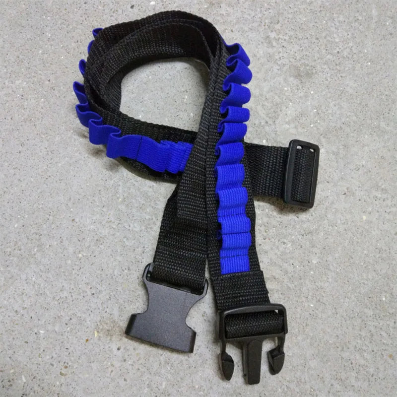 A black and blue soft foam dart refill product with a strap and clip is shown on a light gray surface.