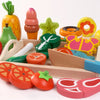 A wooden magnetic fruit and vegetable cutting play set featuring various colorful fruits and vegetables.