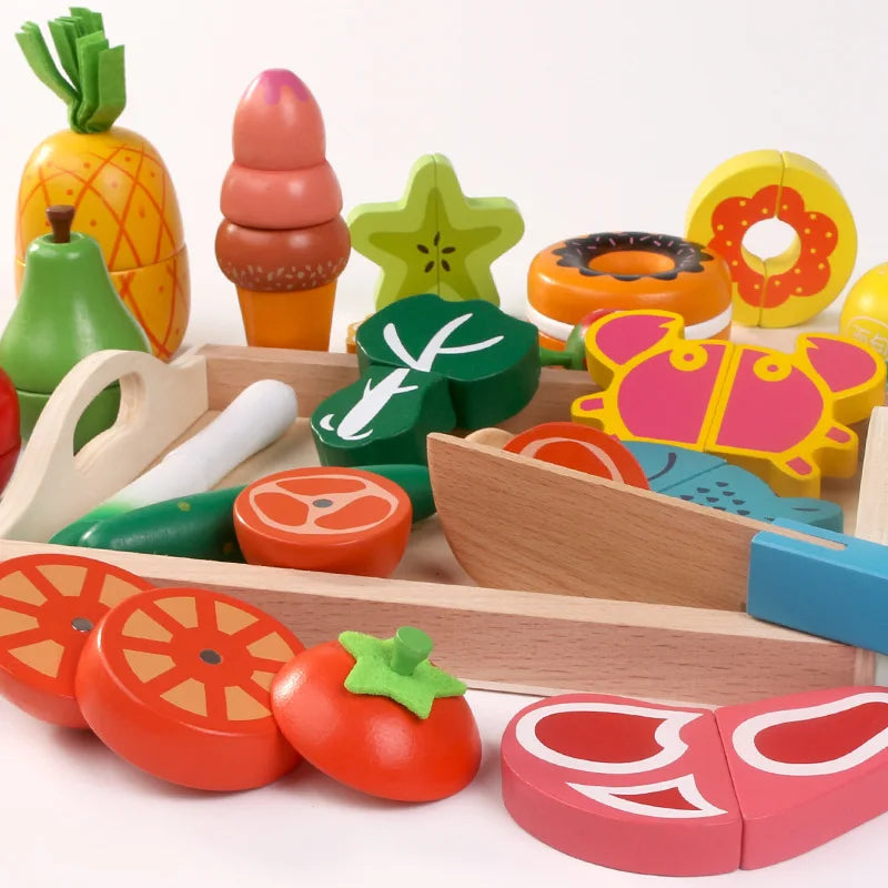 A wooden magnetic fruit and vegetable cutting play set featuring various colorful fruits and vegetables.