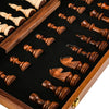 Handcrafted wooden folding chess set with solid walnut pieces displayed in a wooden box.