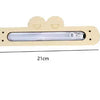 A light-colored wooden DIY Montessori busy board with a clear light panel for sensory learning.