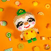 A collection of colorful building blocks and small candies scattered on an orange background.