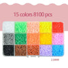A variety of 15 colors of 8100 plastic fuse beads in small containers for crafting and puzzles.