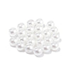 A pile of small, white imitation pearl beads for DIY jewelry making.