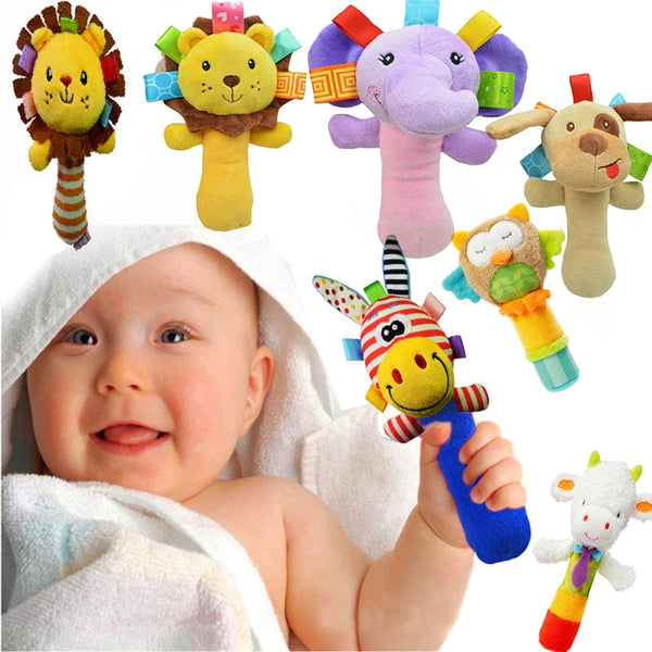 A baby is holding various colorful wrist rattles featuring animals like a lion and elephant.