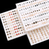 A collection of assorted acrylic stud earrings featuring hearts, stars, and moons in various gold and silver tones.