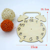 A wooden Montessori busy board clock and an orange ball made of yarn for sensory learning.