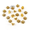 A collection of 12 gold-colored Tibetan style hollow flower bead caps for jewelry making, shown against a white background.