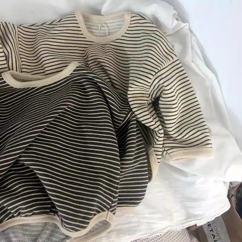 A striped kids cotton pullover sweatshirt in olive green and cream tones.