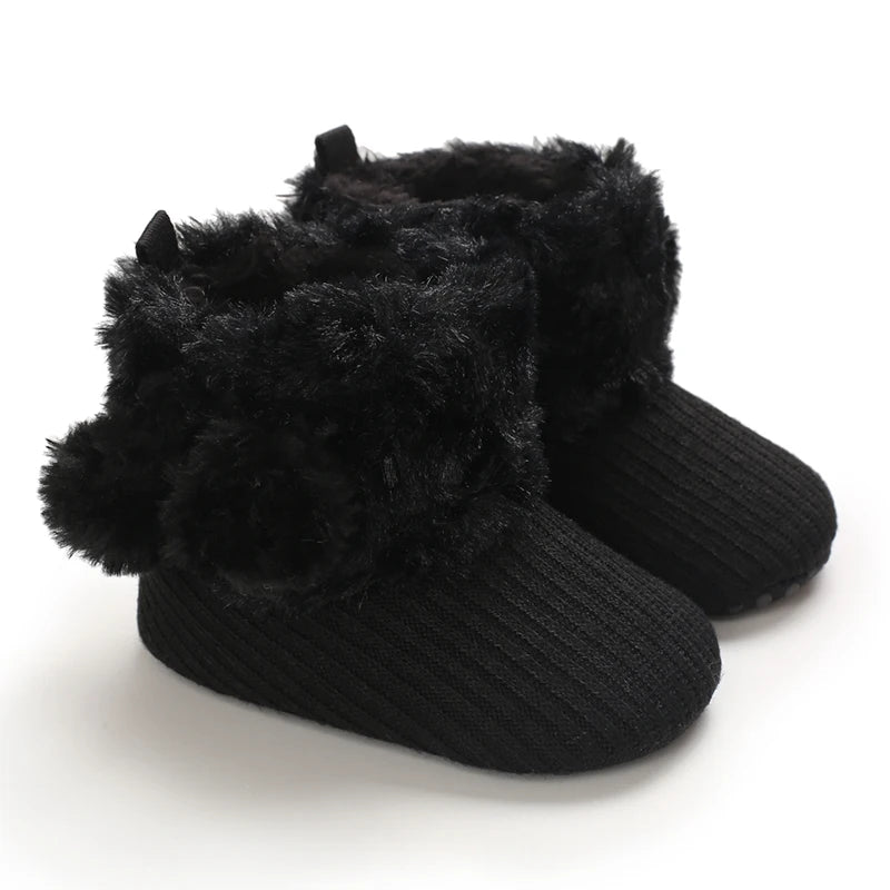 Black plush baby snow boots for girls and boys with a fuzzy trim