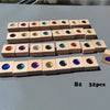 A collection of 32 wooden gemstone building blocks featuring various colored acrylic crystals arranged in rows.