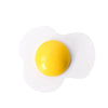 A single bright yellow egg resting on a white magnetic wooden cutting toy mold.