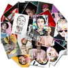 A collage of various graffiti and artistic stickers featuring faces, skulls, and abstract designs.