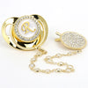 Gold rhinestone pacifier featuring a personalized initial on a silicone clip and chain.