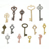 A collection of vintage metal key charms in various styles and finishes for DIY jewelry making