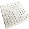 A white silicone mat with small, round, heat-resistant double-sided stickers arranged in a grid.
