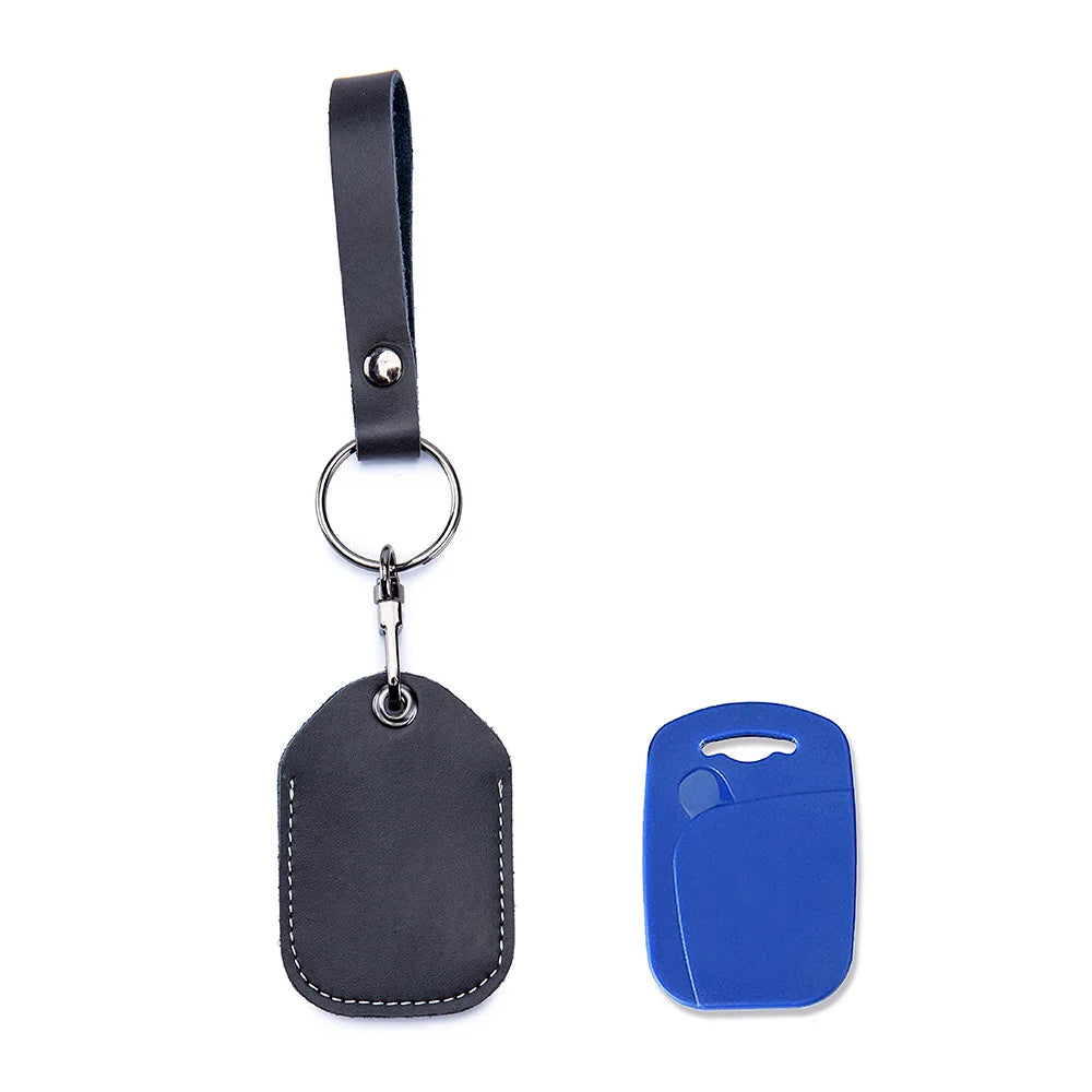 A black vintage cowhide leather key wallet with a metal ring and a blue plastic key fob.