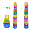A set of 11 boat-shaped stacking cups in various colors and letters for toddlers