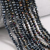 Dark blue faceted crystal glass beads strung on threads for jewelry making