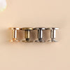 Four decorative heart brass rivets with silver and gold finishes arranged in a row.