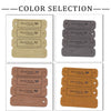 A collection of leather-style handmade with love tags in four different colors: tan, gray, brown, and orange.