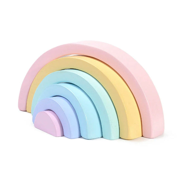 A set of wooden rainbow building blocks in pastel colors, arranged in an arc.