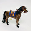 A 1/12 scale dollhouse horse with a brown coat, black mane and tail, wearing a brown leather saddle and riding prop.