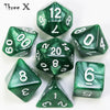 A set of green marble effect polyhedral dice including a dodecahedron, tetrahedron, and other shapes.