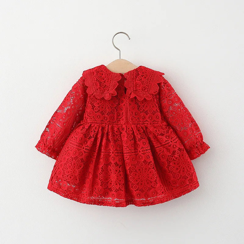 A red lace princess dress for a toddler girl with a doll collar, displayed on a hanger.