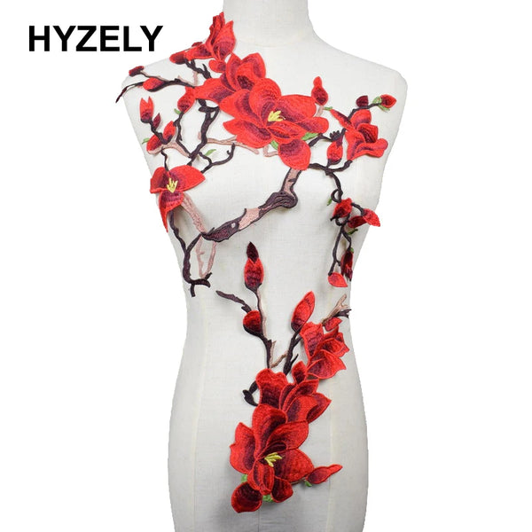Red plum blossom embroidered clothing patch displayed on a mannequin torso.