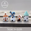 Set of four white miniature house figurines with blue accents for fairy gardens