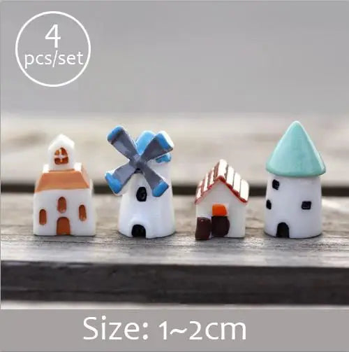 Set of four white miniature house figurines with blue accents for fairy gardens