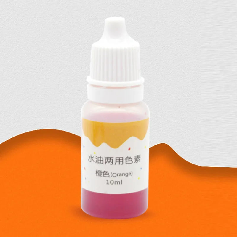 A small glass bottle containing pink liquid soap colorant dye labeled Orange with a white dropper cap.