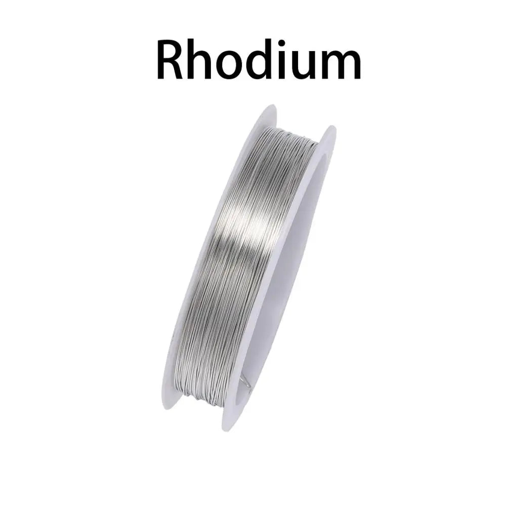 A spool of thin, silver-colored beading wire for jewelry making.