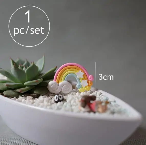 A miniature rainbow figurine is placed on a white, textured surface inside a small bowl.