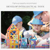 Two children build structures with colorful magnetic building tiles in a learning environment.
