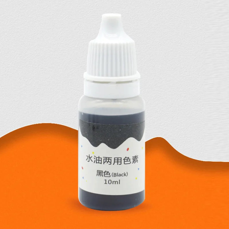 A small glass bottle containing black liquid soap colorant dye labeled for 10ml.