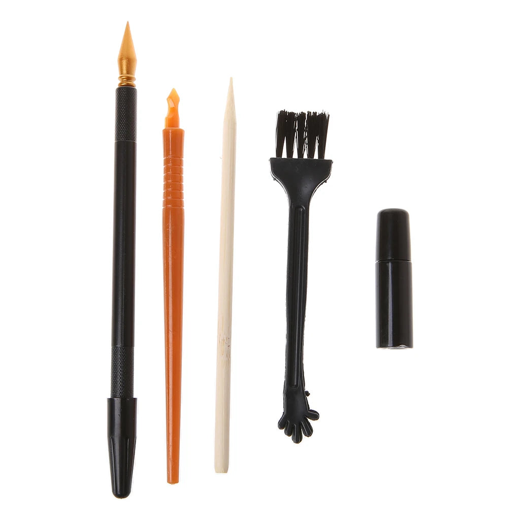 A set of five scratch art tools including a needle, orange stick, pencil, brush, and black tube.