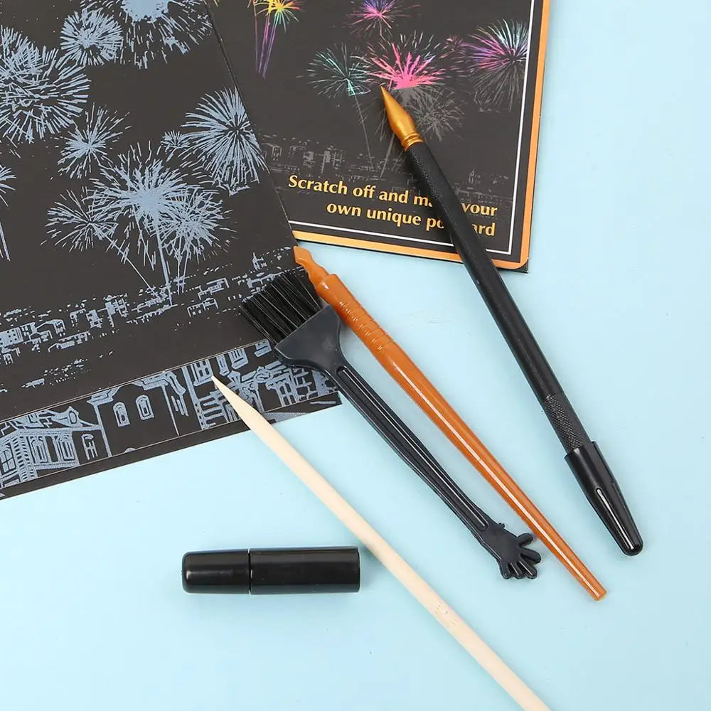 A set of scratch art tools including a brush, pencil, and a black marker on a light blue background.