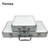 A silver aluminum poker chip carry case with a lock and handle resting on a non-slip mat.