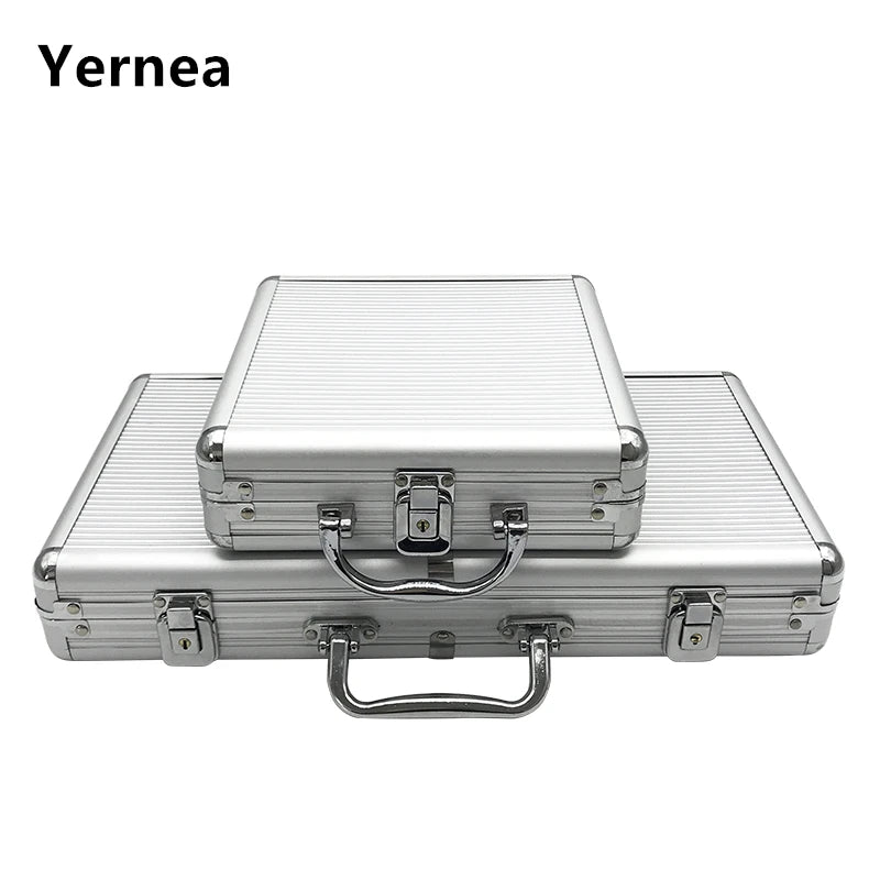 A silver aluminum poker chip carry case with a lock and handle resting on a non-slip mat.