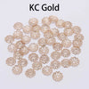 A collection of gold-colored flower petal bead caps for jewelry making.