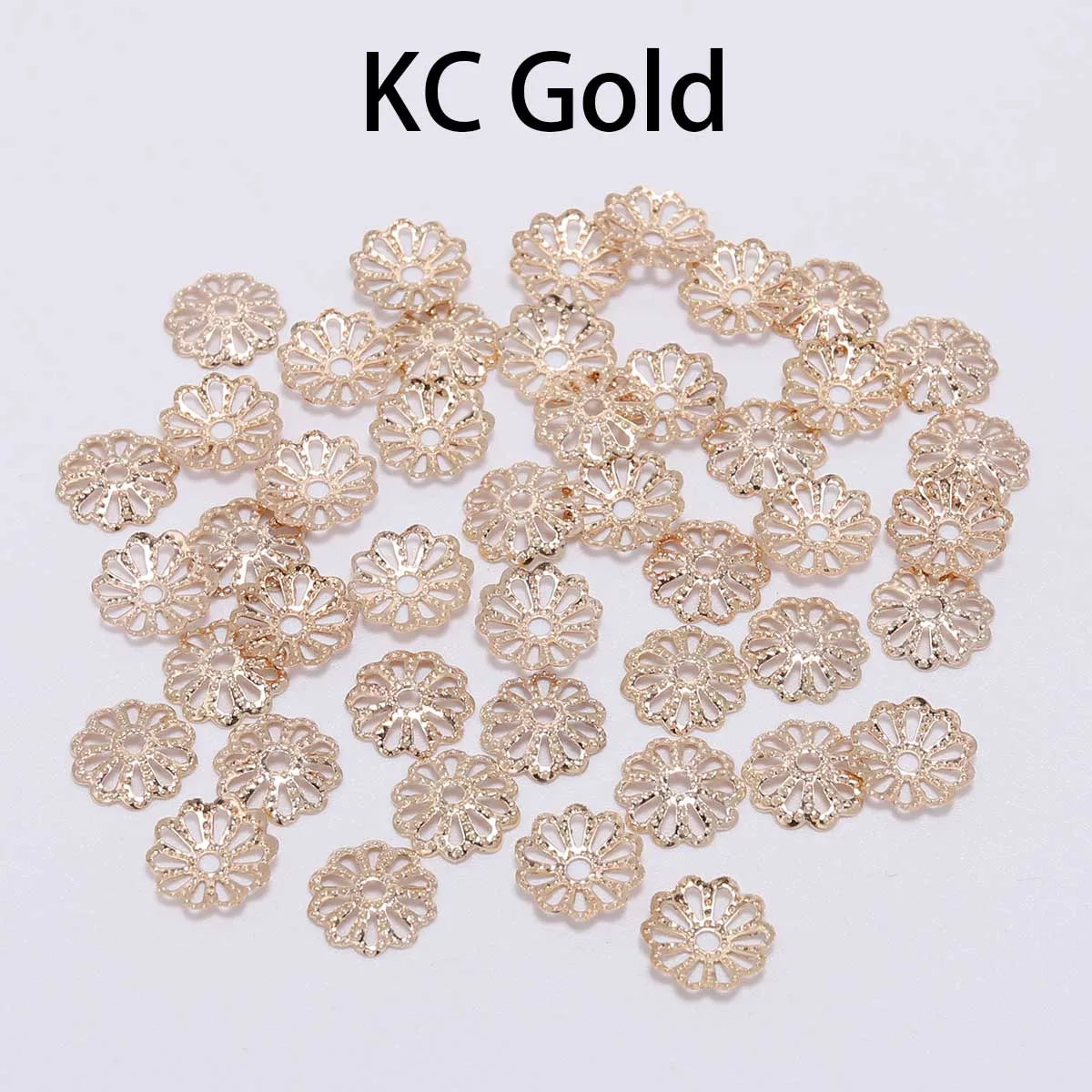A collection of gold-colored flower petal bead caps for jewelry making.