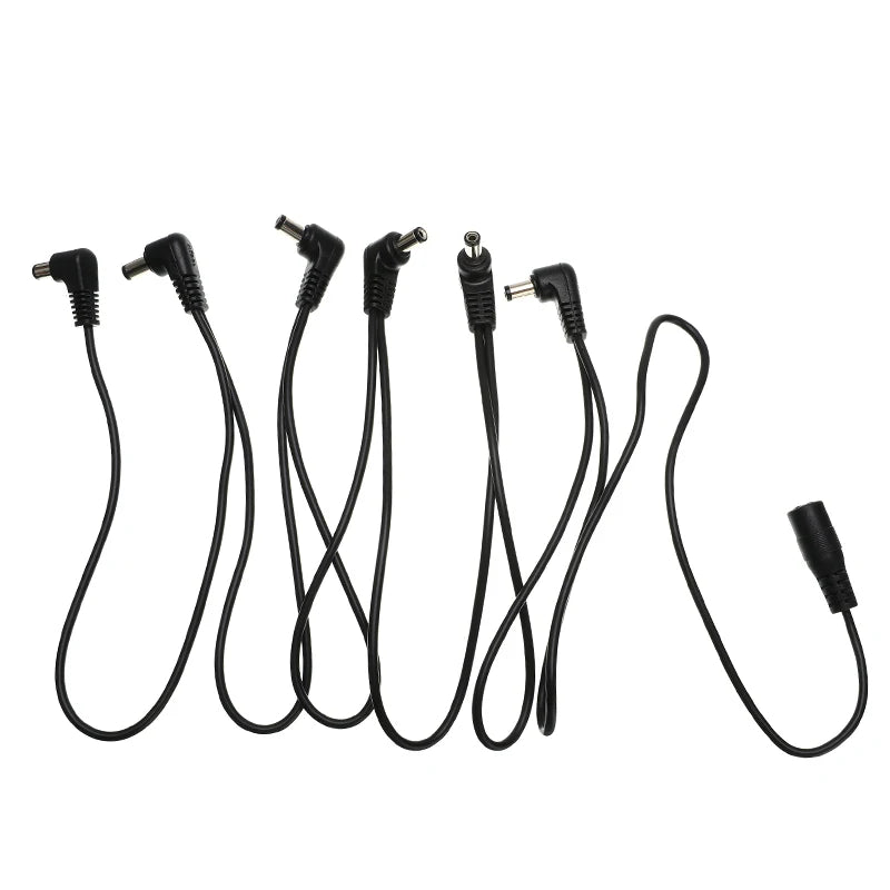 A set of guitar pedal power daisy chain cables with various connectors.