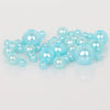 A pile of light blue imitation pearl beads for DIY jewelry making
