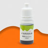 A small white bottle containing a green liquid colorant dye labeled for use in water-based solutions.